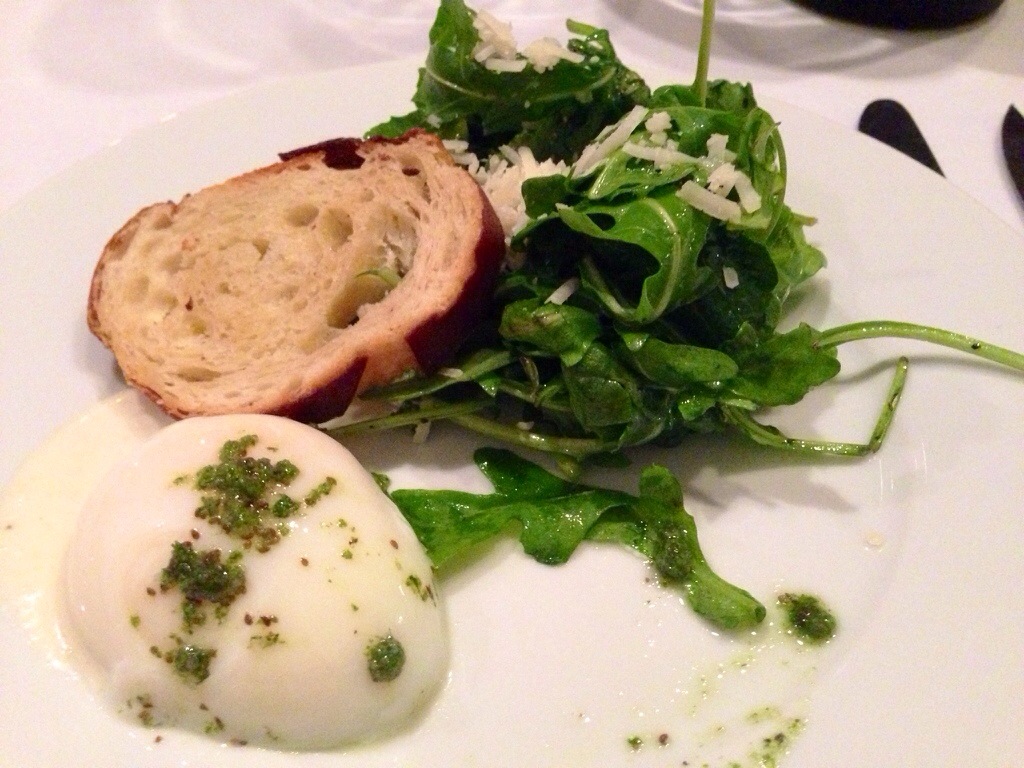 63 degree poached egg over parmesean anchovy aoili and celery salt w/ baby kale and arugula salad. Pretzel crouton on top.