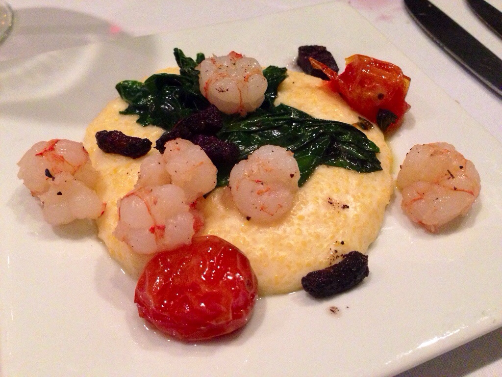 Rock shrimp cheddar grits w/ bacon confit and braised mustard greens