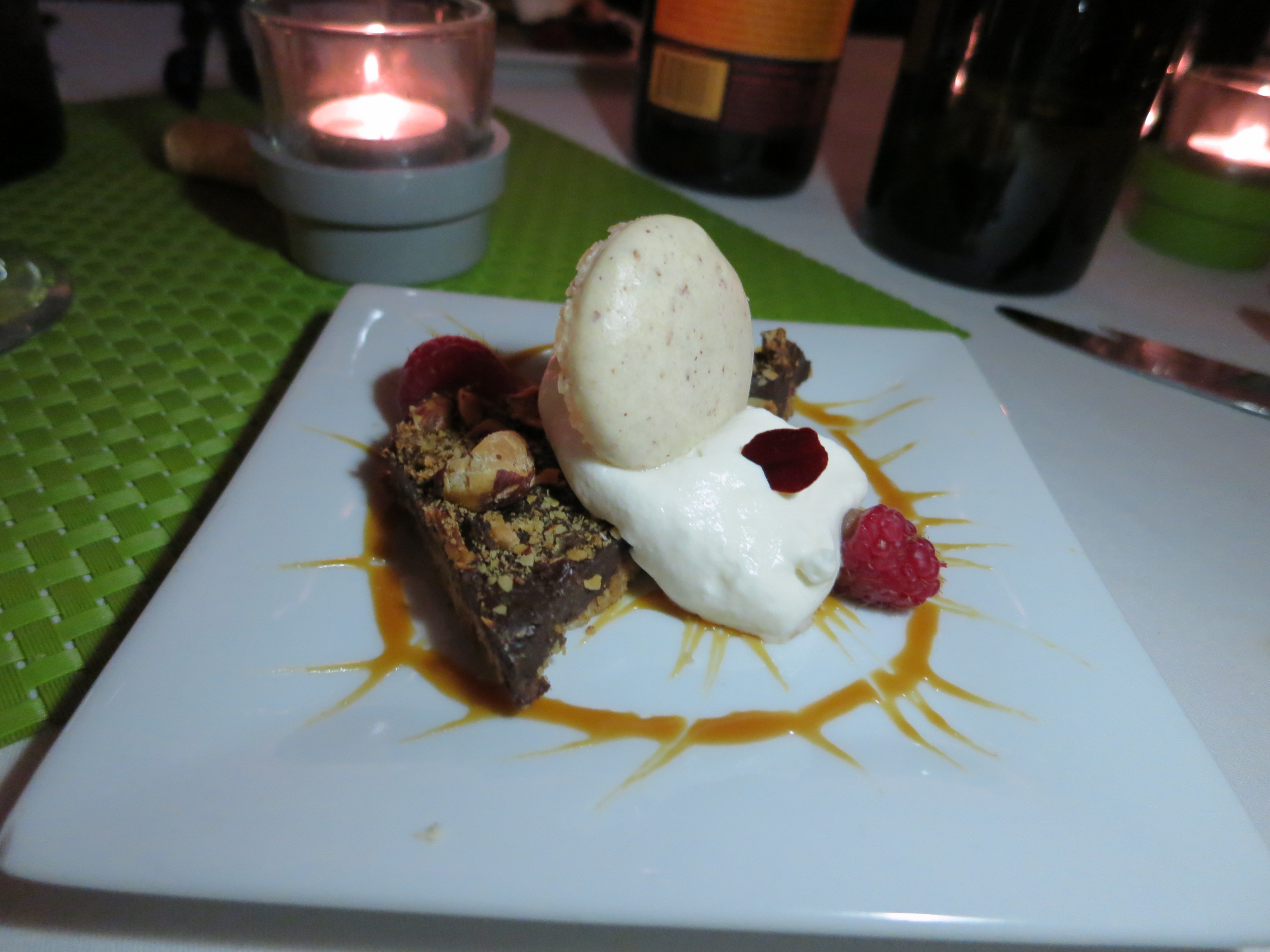 Hazelnut ganache with Frangelico whipped cream, raspberries, and macaron